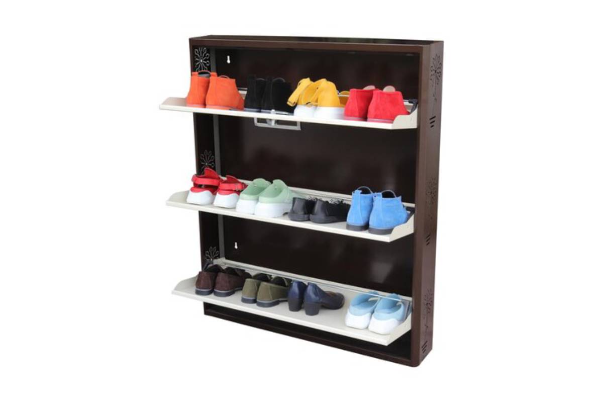A stylish shoe rack with four shelves displaying a variety of colorful shoes, set against a dark wooden background.